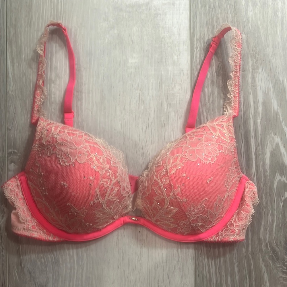 Victoria secret pink bra with nude lace and rhinestones.was only worn twice.